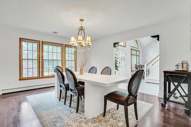 1138 Carlls Straight Path, Dix Hills, NY 11746 - dining space with a baseboard heating unit, a chandelier, stairway, and dark wood-style flooring