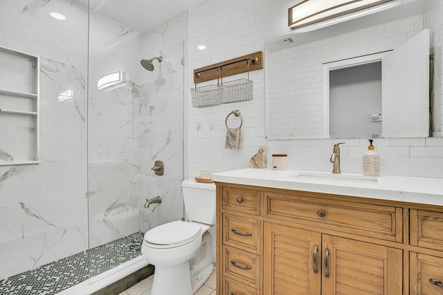 1138 Carlls Straight Path, Dix Hills, NY 11746 - full bathroom with tile walls, vanity, toilet, a marble finish shower, and tasteful backsplash