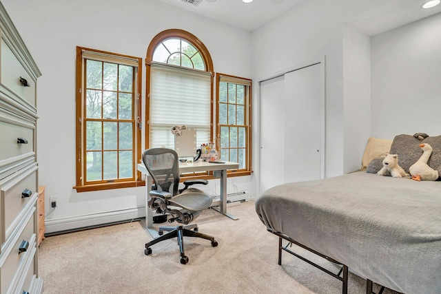 1138 Carlls Straight Path, Dix Hills, NY 11746 - bedroom with a baseboard radiator, a closet, light colored carpet, and a desk