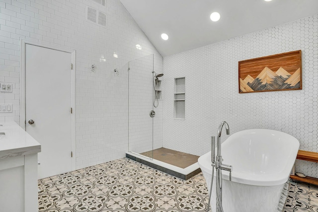 1138 Carlls Straight Path, Dix Hills, NY 11746 - full bath featuring a tile shower, vaulted ceiling, a freestanding tub, tile patterned flooring, and vanity