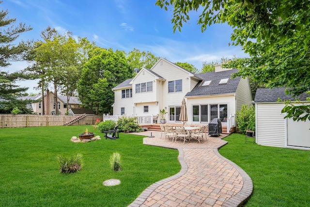 1138 Carlls Straight Path, Dix Hills, NY 11746 - back of house with an outdoor fire pit, a patio area, and a shingled roof