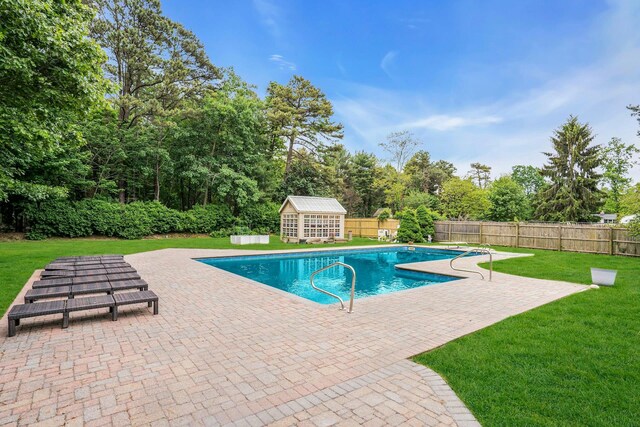 1138 Carlls Straight Path, Dix Hills, NY 11746 - view of swimming pool featuring a patio, an outbuilding, and view of scattered trees