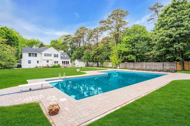 1138 Carlls Straight Path, Dix Hills, NY 11746 - view of pool with a diving board, a patio area, view of scattered trees, and an outbuilding