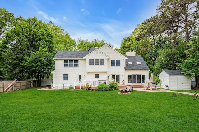 1138 Carlls Straight Path, Dix Hills, NY 11746 - back of house with a wooden deck, a patio area, a fire pit, and a chimney