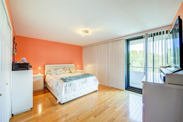 10-11 162nd St Unit 7A, Beechhurst, NY 11357 - bedroom featuring access to exterior and light wood finished floors