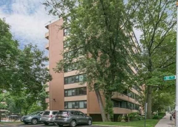 10-11 162nd St Unit 7A, Beechhurst, NY 11357 - view of building exterior featuring uncovered parking