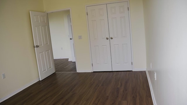 355 Kings Hwy Unit 5C, Brooklyn, NY 11223 - unfurnished bedroom featuring dark wood-style flooring, baseboards, and a closet