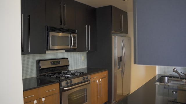 355 Kings Hwy Unit 5C, Brooklyn, NY 11223 - kitchen with appliances with stainless steel finishes, tasteful backsplash, dark cabinets, and a sink
