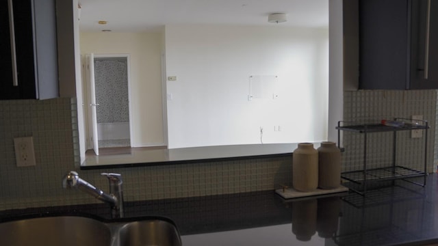 355 Kings Hwy Unit 5C, Brooklyn, NY 11223 - kitchen featuring a sink, tasteful backsplash, and dark countertops