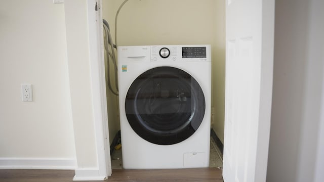 355 Kings Hwy Unit 5C, Brooklyn, NY 11223 - laundry area featuring washer / dryer, wood finished floors, and baseboards