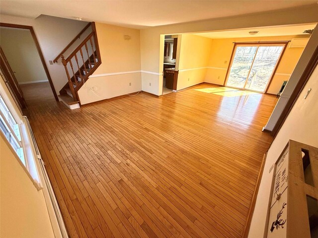 118 White Brg, Middletown, NY 10940 - unfurnished room with stairs, light wood-style flooring, and baseboards