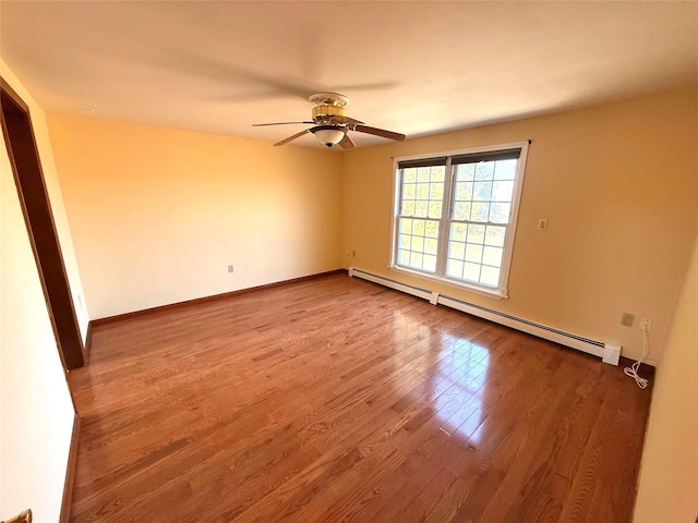 118 White Brg, Middletown, NY 10940 - spare room featuring a baseboard heating unit, wood finished floors, ceiling fan, and baseboards
