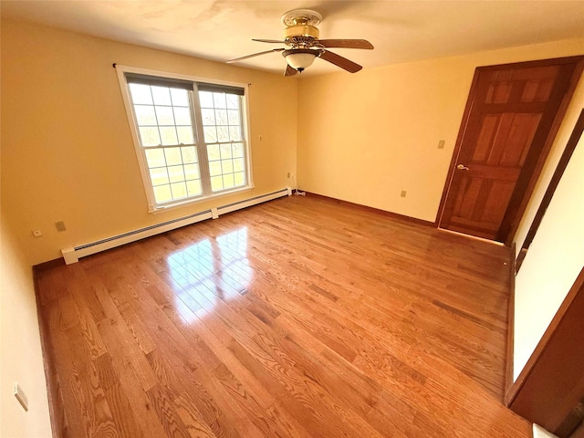 118 White Brg, Middletown, NY 10940 - empty room with a baseboard radiator, light wood-type flooring, ceiling fan, and baseboards