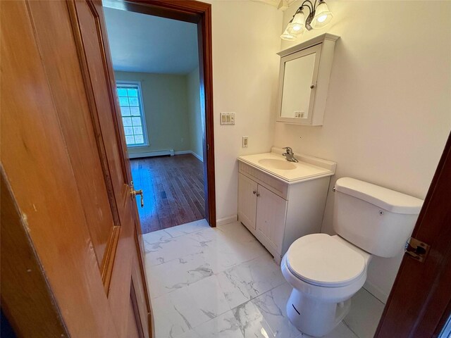 118 White Brg, Middletown, NY 10940 - half bathroom with toilet, vanity, marble look tiles, baseboards, and baseboard heating