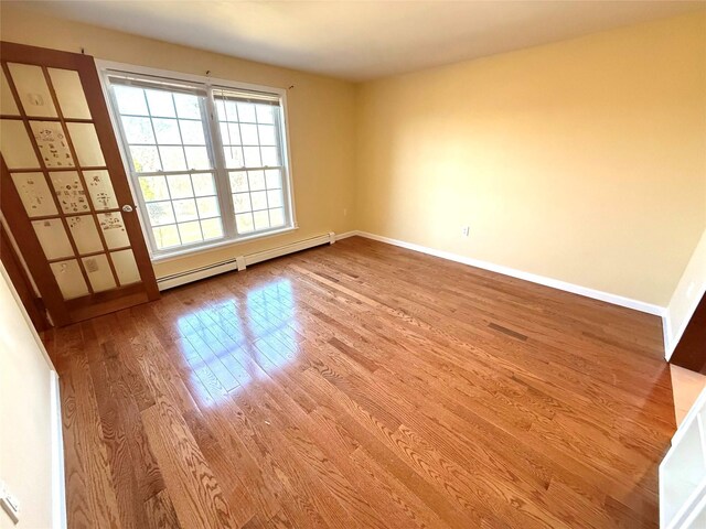 118 White Brg, Middletown, NY 10940 - spare room with a baseboard radiator, wood finished floors, and baseboards