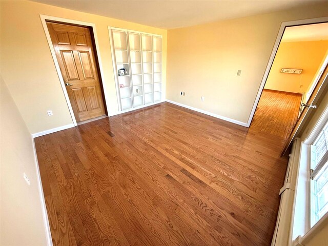 118 White Brg, Middletown, NY 10940 - empty room with wood finished floors, baseboards, and built in features