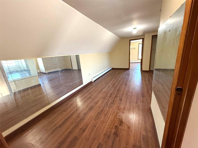 118 White Brg, Middletown, NY 10940 - additional living space with baseboard heating, dark wood-style floors, lofted ceiling, and baseboards