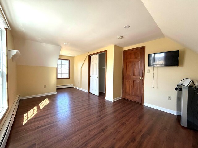 118 White Brg, Middletown, NY 10940 - additional living space featuring baseboard heating, dark wood-type flooring, baseboards, lofted ceiling, and recessed lighting
