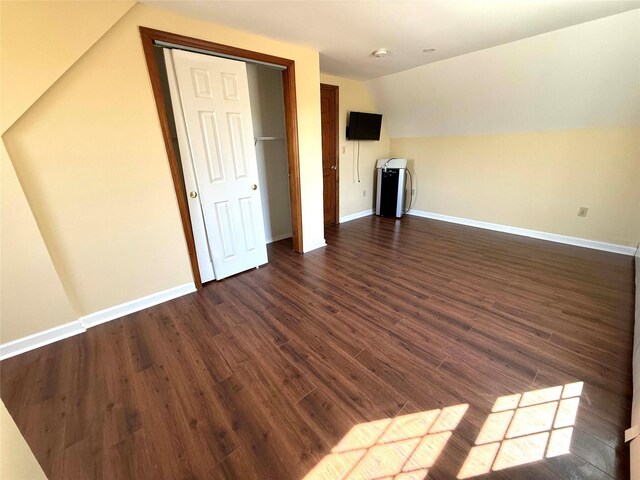 118 White Brg, Middletown, NY 10940 - unfurnished living room featuring vaulted ceiling, dark wood-style flooring, and baseboards