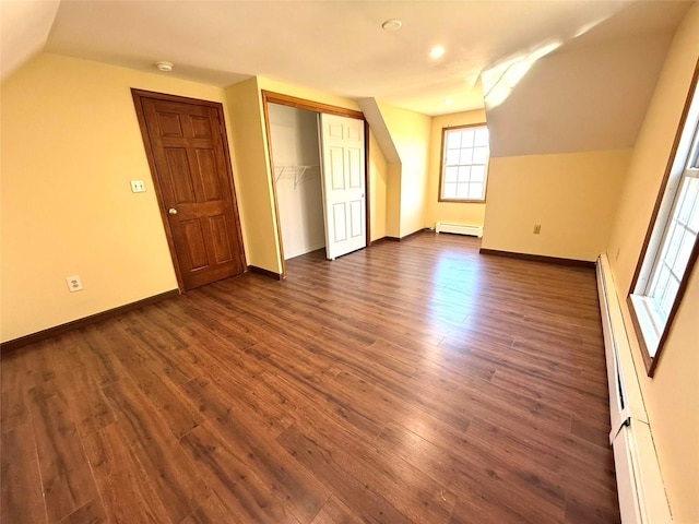 118 White Brg, Middletown, NY 10940 - additional living space featuring vaulted ceiling, baseboard heating, dark wood-type flooring, baseboards, and recessed lighting
