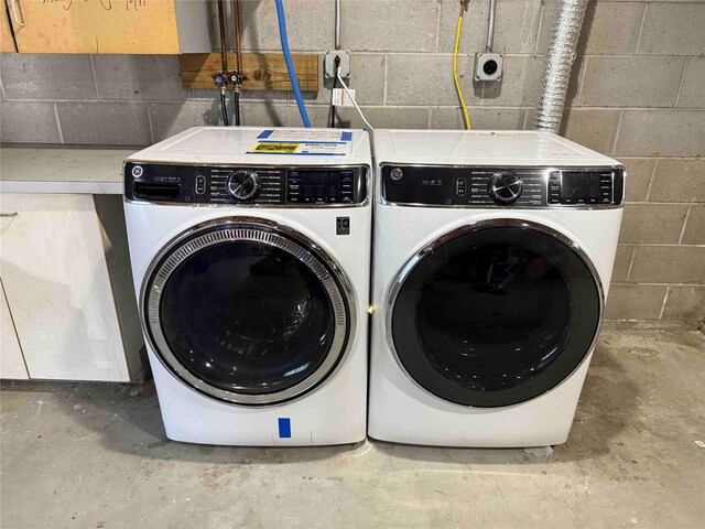 118 White Brg, Middletown, NY 10940 - washroom with concrete block wall and separate washer and dryer