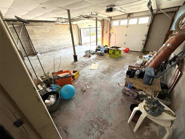 118 White Brg, Middletown, NY 10940 - garage featuring a garage door opener and concrete block wall