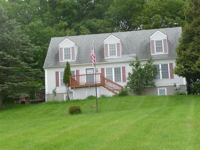 118 White Brg, Middletown, NY 10940 - cape cod house featuring a wooden deck, a front yard, and roof with shingles