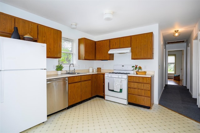 252 Rokeby Rd, Red Hook, NY 12571 - kitchen with white appliances, under cabinet range hood, a sink, and light countertops