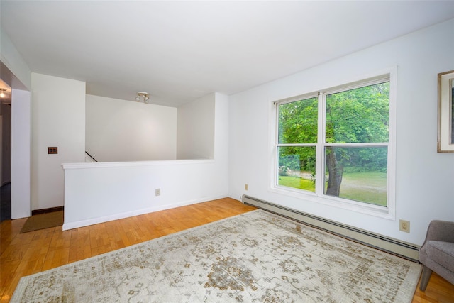 252 Rokeby Rd, Red Hook, NY 12571 - unfurnished room with baseboard heating, wood finished floors, and baseboards