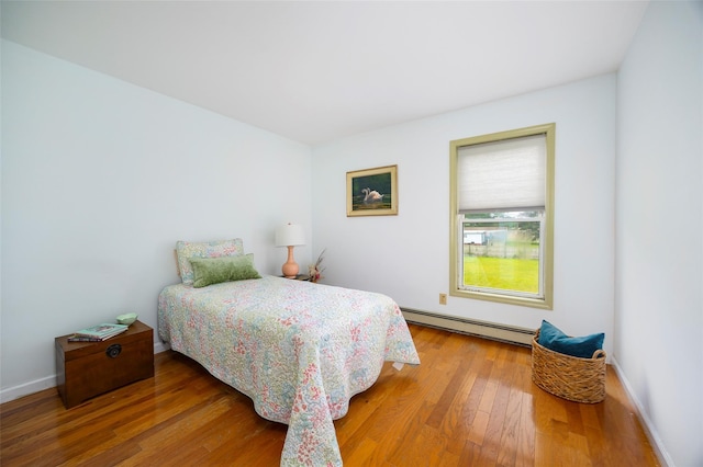 252 Rokeby Rd, Red Hook, NY 12571 - bedroom with baseboard heating, wood finished floors, and baseboards
