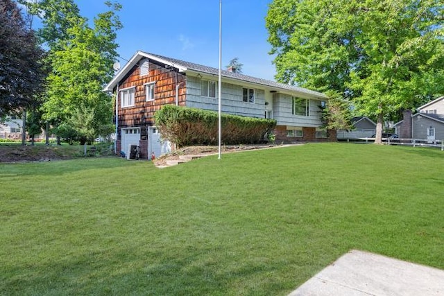 10 Lisa Dr, Northport, NY 11768 - back of house with a garage and a yard
