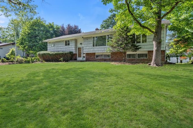 10 Lisa Dr, Northport, NY 11768 - view of front of home with a front lawn