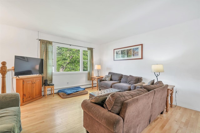 19 Decker Dr, Washingtonville, NY 10992 - living area with light wood-type flooring and a baseboard radiator