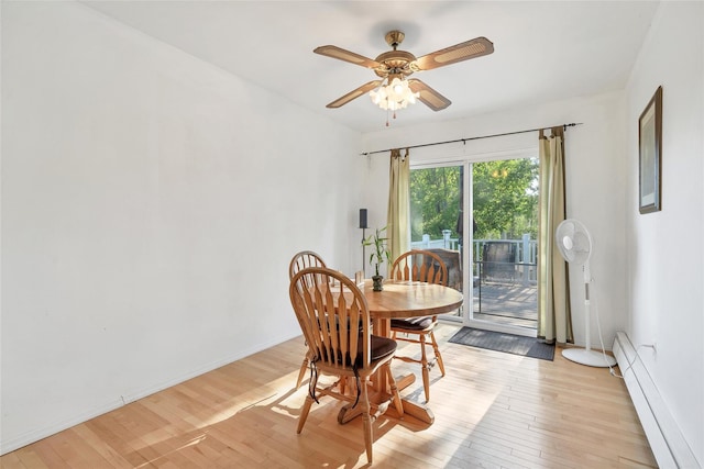 19 Decker Dr, Washingtonville, NY 10992 - dining room with a baseboard radiator, light wood-style floors, ceiling fan, and baseboards