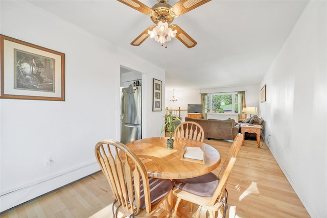 19 Decker Dr, Washingtonville, NY 10992 - dining space with a baseboard radiator, light wood finished floors, ceiling fan, and baseboards