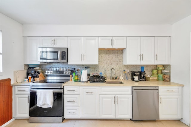 19 Decker Dr, Washingtonville, NY 10992 - kitchen featuring stainless steel appliances, a sink, and white cabinetry