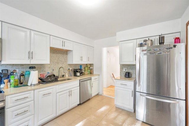 19 Decker Dr, Washingtonville, NY 10992 - kitchen with appliances with stainless steel finishes, tasteful backsplash, white cabinetry, and light countertops