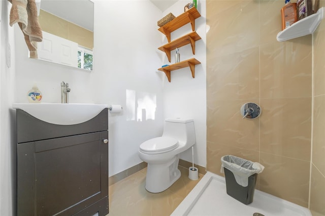 19 Decker Dr, Washingtonville, NY 10992 - full bathroom with vanity, a tile shower, toilet, tile patterned flooring, and baseboards