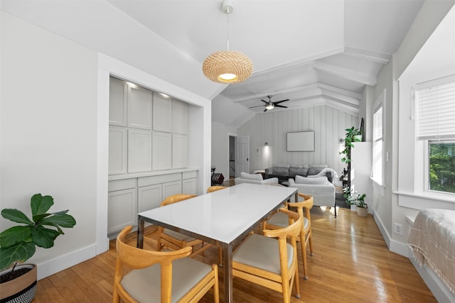 162 Lake Dr, Lake Peekskill, NY 10537 - dining room with vaulted ceiling, light wood finished floors, a ceiling fan, and baseboards