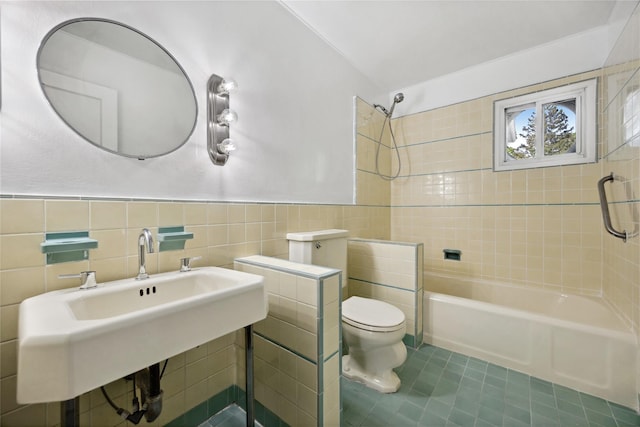 119 Knickerbocker Rd, Manhasset, NY 11030 - bathroom with tile walls, toilet, shower / tub combination, tile patterned flooring, and a sink