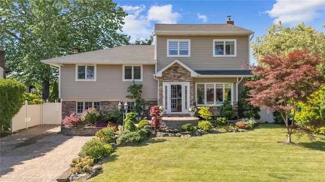 3 Deb St, Plainview, NY 11803 - back of property with stone siding, a chimney, decorative driveway, and a shingled roof