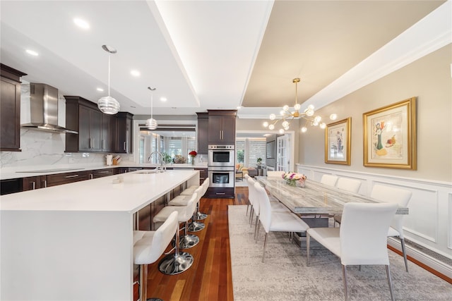 3 Deb St, Plainview, NY 11803 - dining area featuring ornamental molding, wainscoting, dark wood-style flooring, a chandelier, and recessed lighting