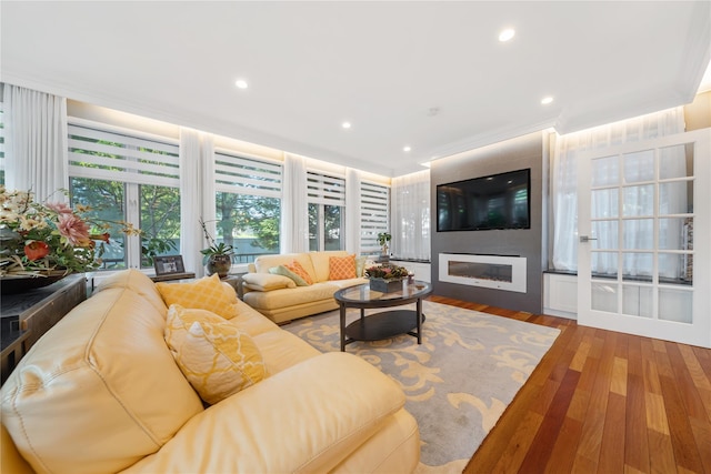 3 Deb St, Plainview, NY 11803 - living room with a glass covered fireplace, wood finished floors, recessed lighting, and crown molding