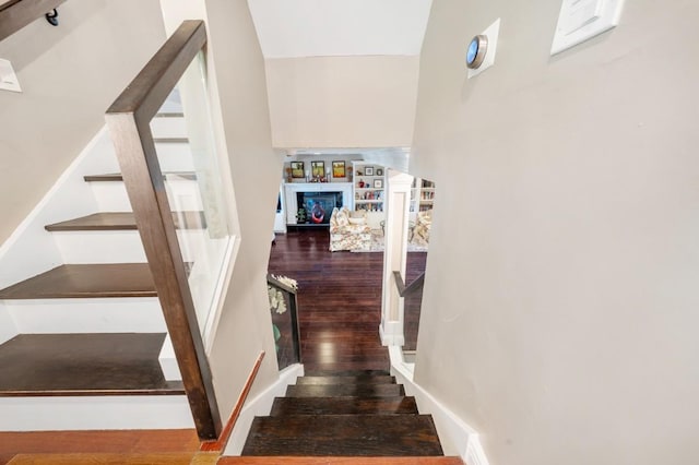 3 Deb St, Plainview, NY 11803 - stairway featuring wood finished floors and a lit fireplace