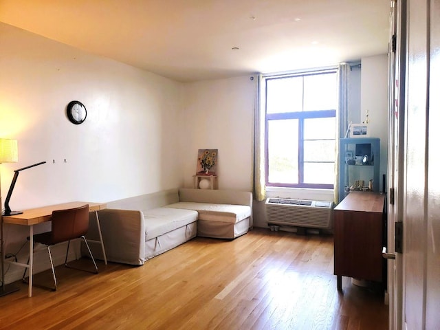 2311 21st Ave Unit 3C, Astoria, NY 11105 - bedroom featuring wood finished floors and a wall unit AC