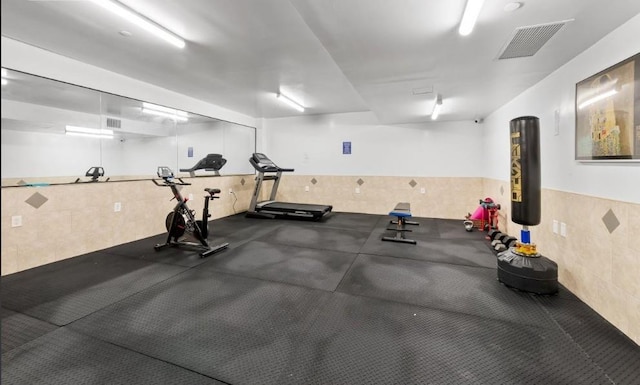 2311 21st Ave Unit 3C, Astoria, NY 11105 - workout area featuring tile walls and wainscoting