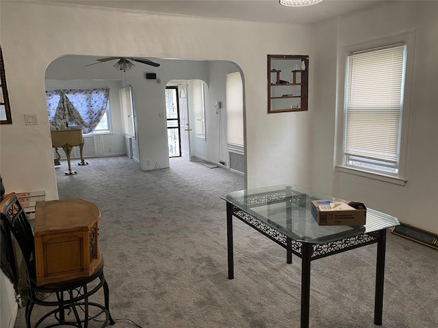 1646 Troy Ave, Brooklyn, NY 11234 - carpeted living room with arched walkways and ceiling fan