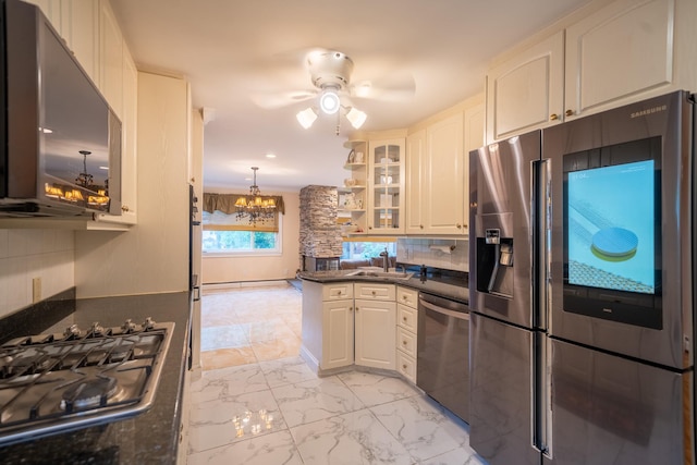 5 Forest Rd, Valley Stream, NY 11581 - kitchen with appliances with stainless steel finishes, a chandelier, a sink, white cabinetry, and ceiling fan