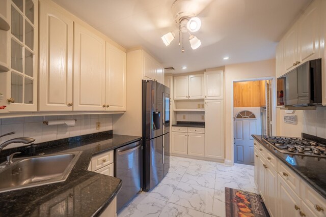 5 Forest Rd, Valley Stream, NY 11581 - kitchen featuring stainless steel appliances, a sink, light marble finish floors, glass insert cabinets, and recessed lighting