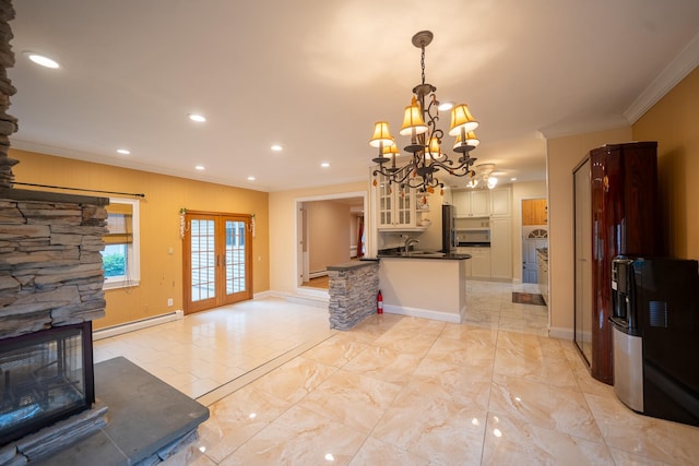 5 Forest Rd, Valley Stream, NY 11581 - kitchen with a baseboard radiator, crown molding, dark countertops, a chandelier, and freestanding refrigerator